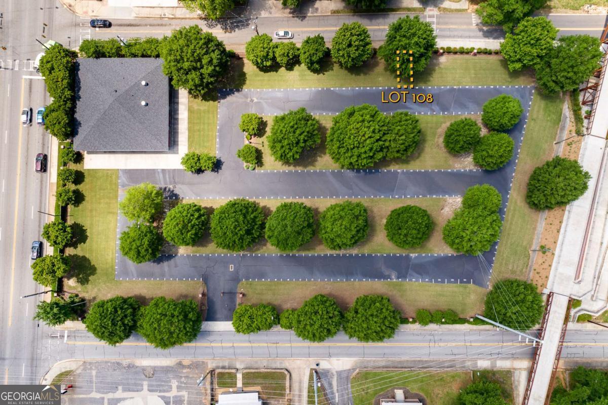 an aerial view of a house with a garden and yard
