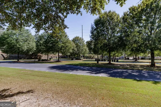a view of a porch with furniture and a yard