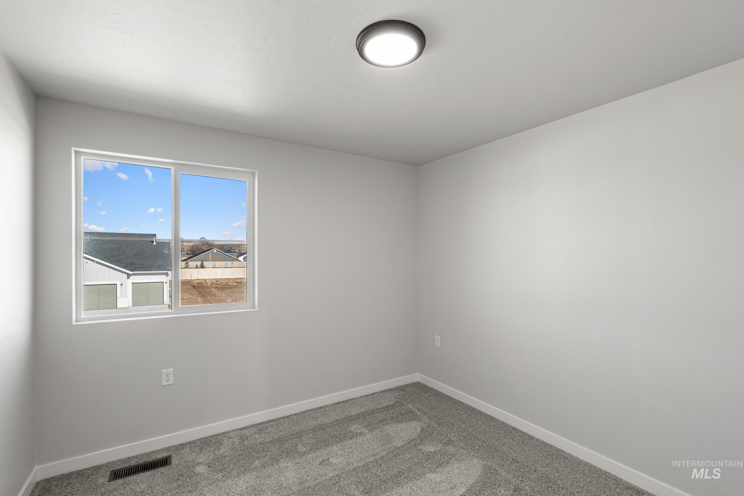 1687 Dyer Street Middleton, ID 83644 - Photo 18 of 28 Unfurnished room featuring carpet and baseboards