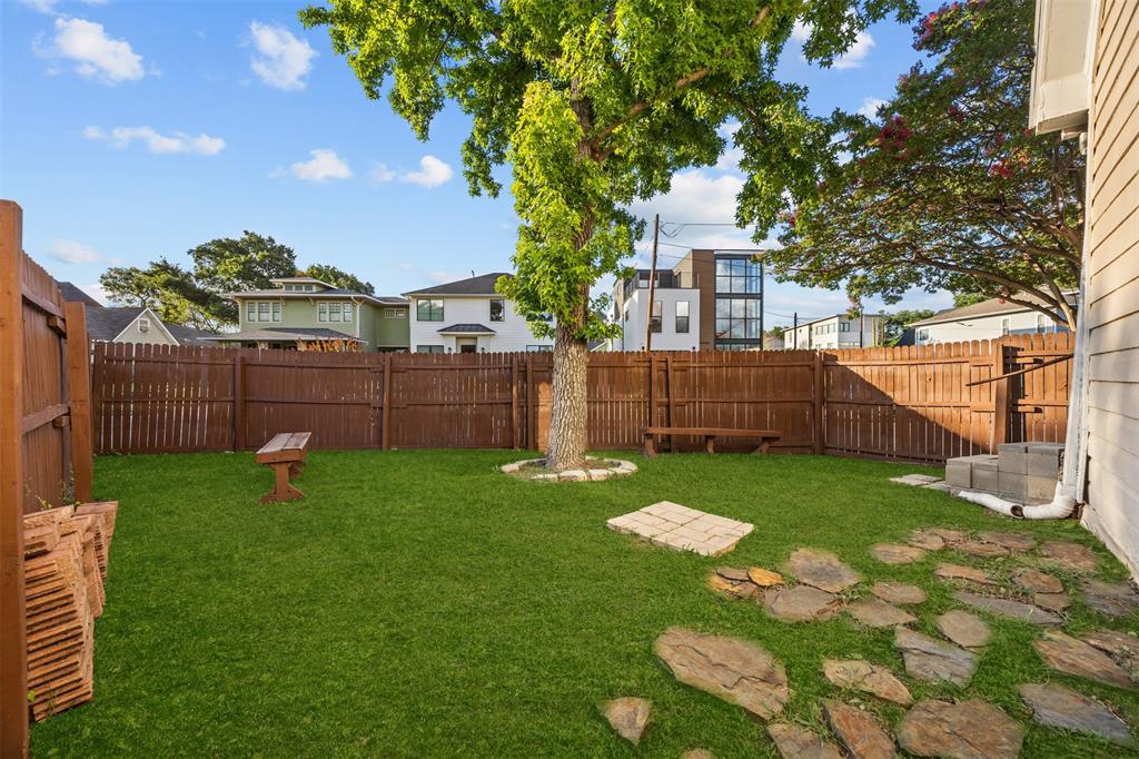 2626 Madera Street Dallas, TX 75206 - Photo 21 of 30 a view of a garden with a slide