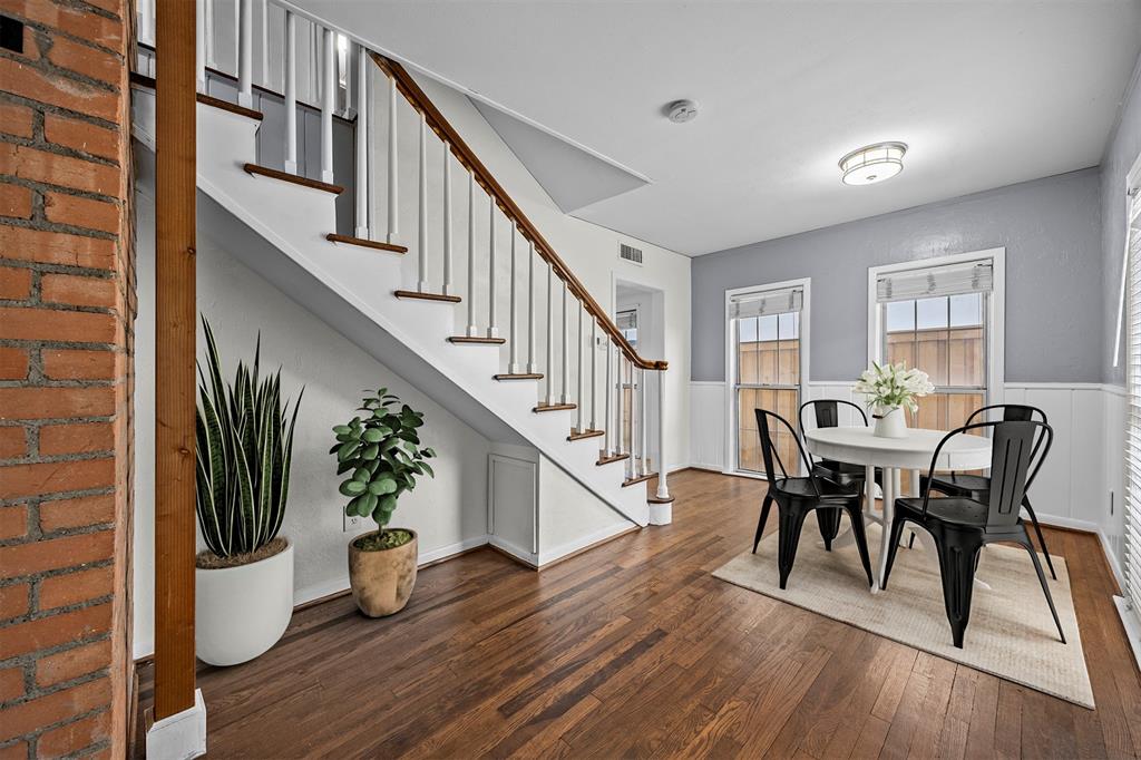 2626 Madera Street Dallas, TX 75206 - Photo 5 of 30 a view of a dining room with furniture a potted plant and wooden floor