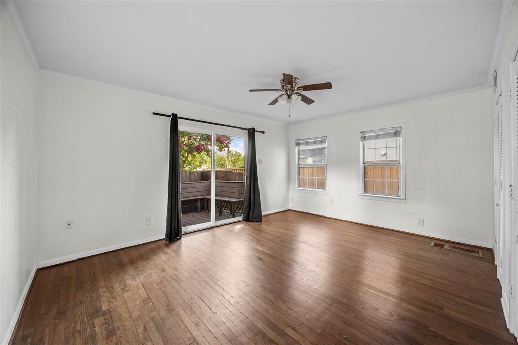 2626 Madera Street Dallas, TX 75206 - Photo 9 of 30 a view of empty room with wooden floor and fan