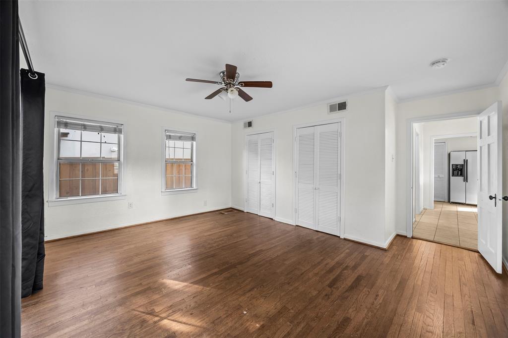 2626 Madera Street Dallas, TX 75206 - Photo 10 of 30 a view of empty room with wooden floor and ceiling fan