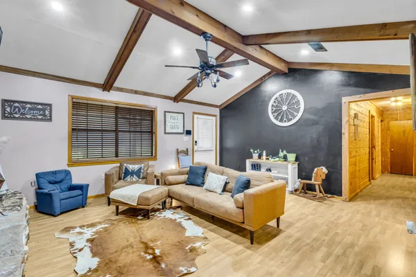 a living room with furniture and a window