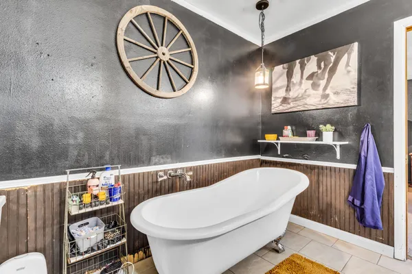 a bathroom with a sink a toilet and bathtub
