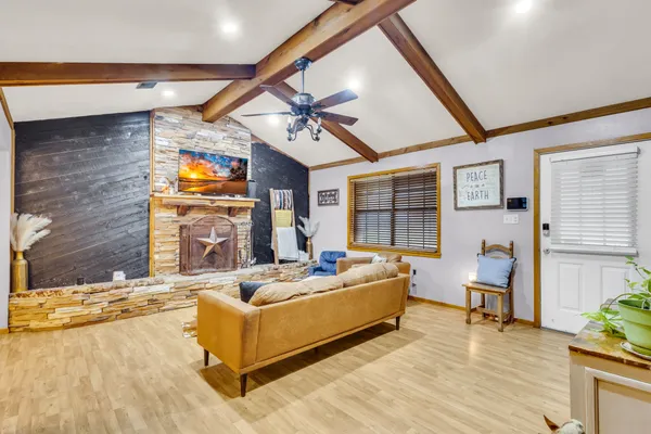 a living room with furniture and flat screen tv