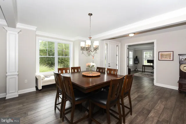 a dining room with furniture window wooden floor