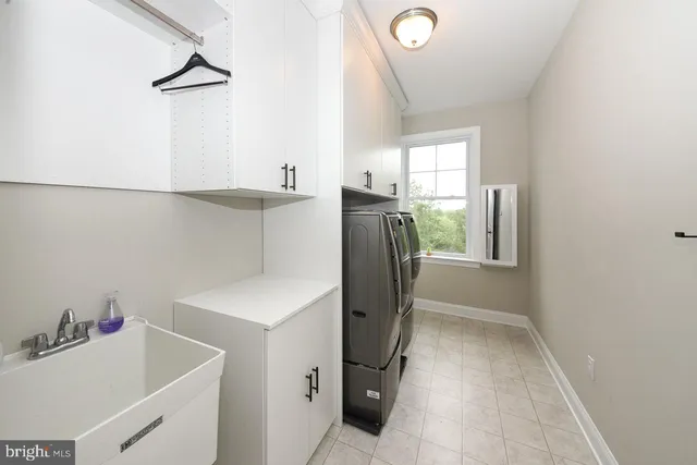 a view of a bathroom with a sink and mirror