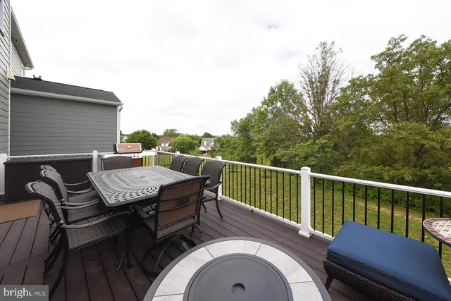 a view of a deck patio and outdoor seating