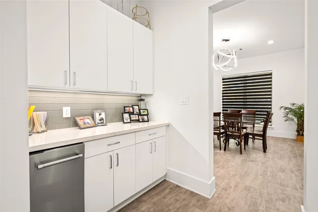 a kitchen with kitchen island a appliances and cabinets
