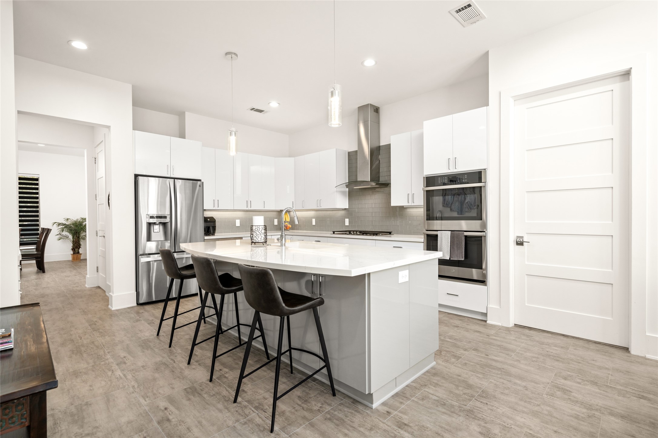 5706 Birdwood Road Houston, TX 77096 - Photo 16 of 50 The chef of the house will love all the counter space and prep area. Double ovens, microwave, and dishwasher are all strategically placed. The layout is well designed and well-lit with additional recessed lighting. The pantry is located in the alcove just past the refrigerator on the right.