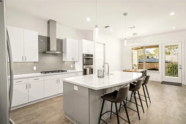 a view of kitchen with sink and living room