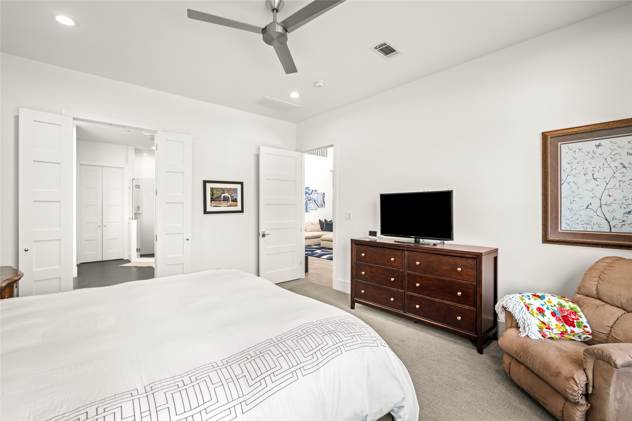 5706 Birdwood Road Houston, TX 77096 - Photo 21 of 50 Another view of the Primary bedroom. Double doors lead to the primary bathroom and closet and a door to the family room to the right.