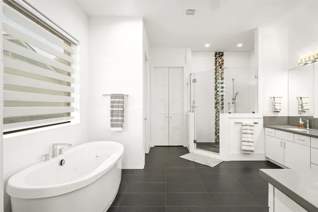 a white bath tub sitting next to a white sink