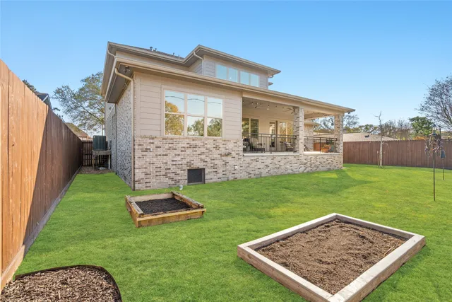 a living room with furniture tv and a large window