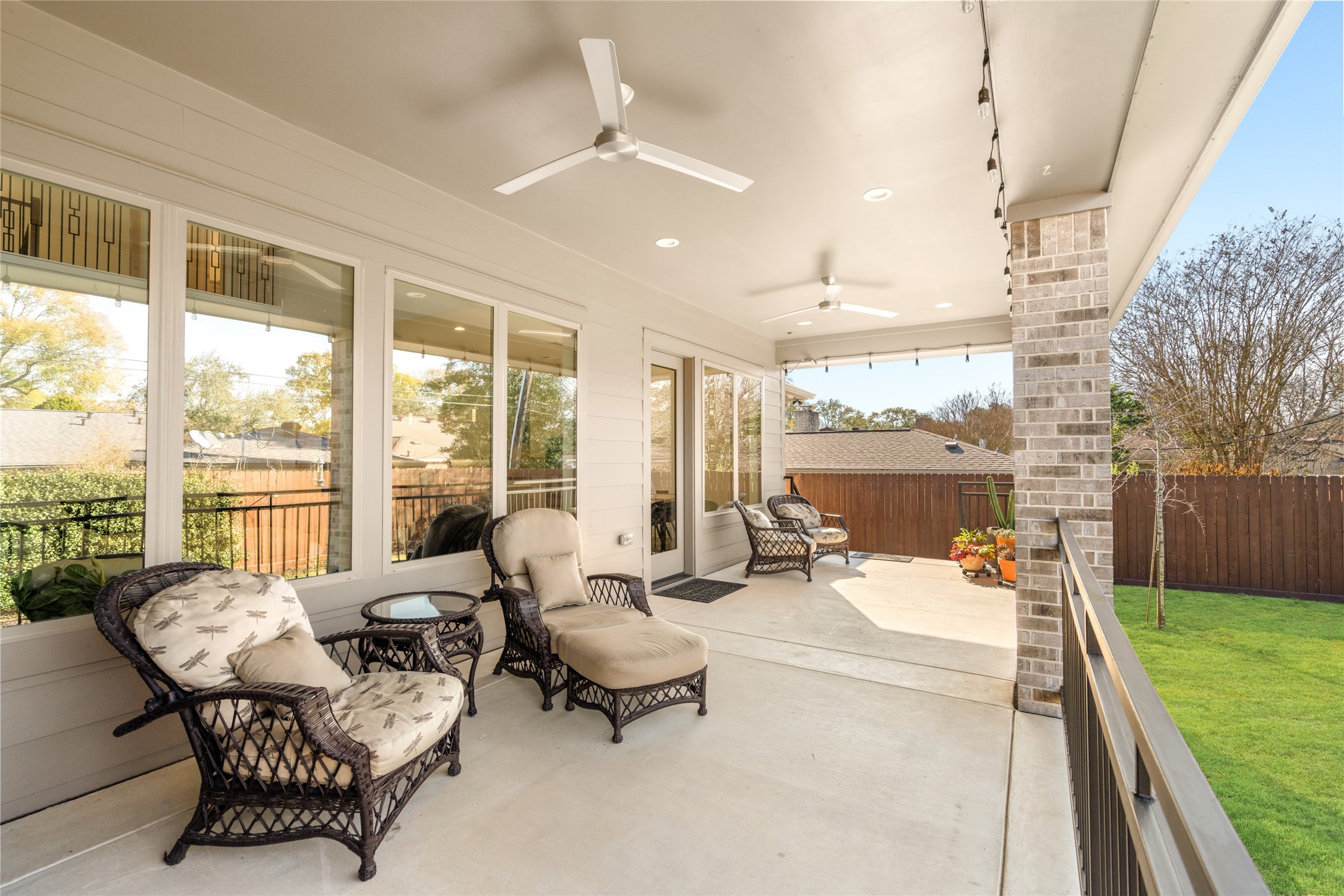 5706 Birdwood Road Houston, TX 77096 - Photo 45 of 50 This inviting outdoor patio features ceiling fans, recessed lighting and a view of a well-maintained yard, perfect for relaxing or entertaining and al fresco dining!