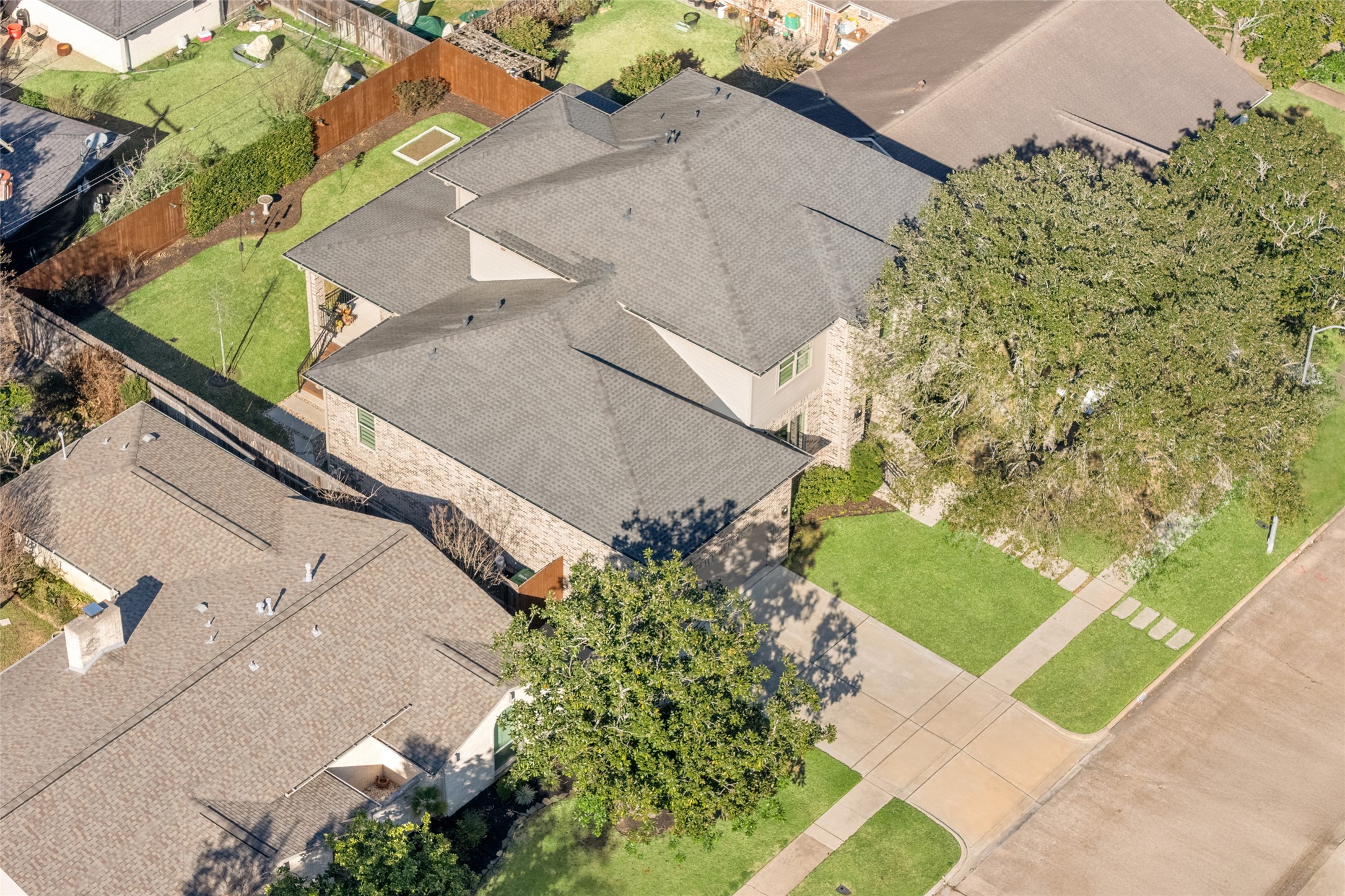 5706 Birdwood Road Houston, TX 77096 - Photo 48 of 50 Aerial view with another perspective of the property showing the stained fence, mature shade tree and well maintained yard.