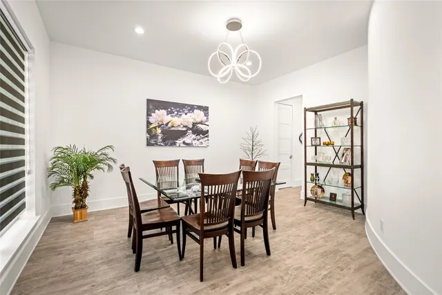 a view of a balcony with furniture and floor to ceiling window