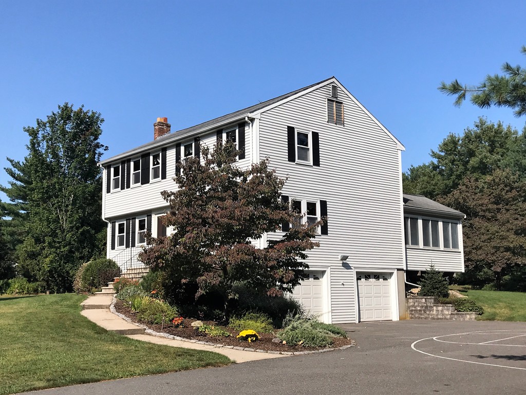 9 Green Valley Road Medway, MA 02053 - Photo 2 of 30 a front view of a house with a garden