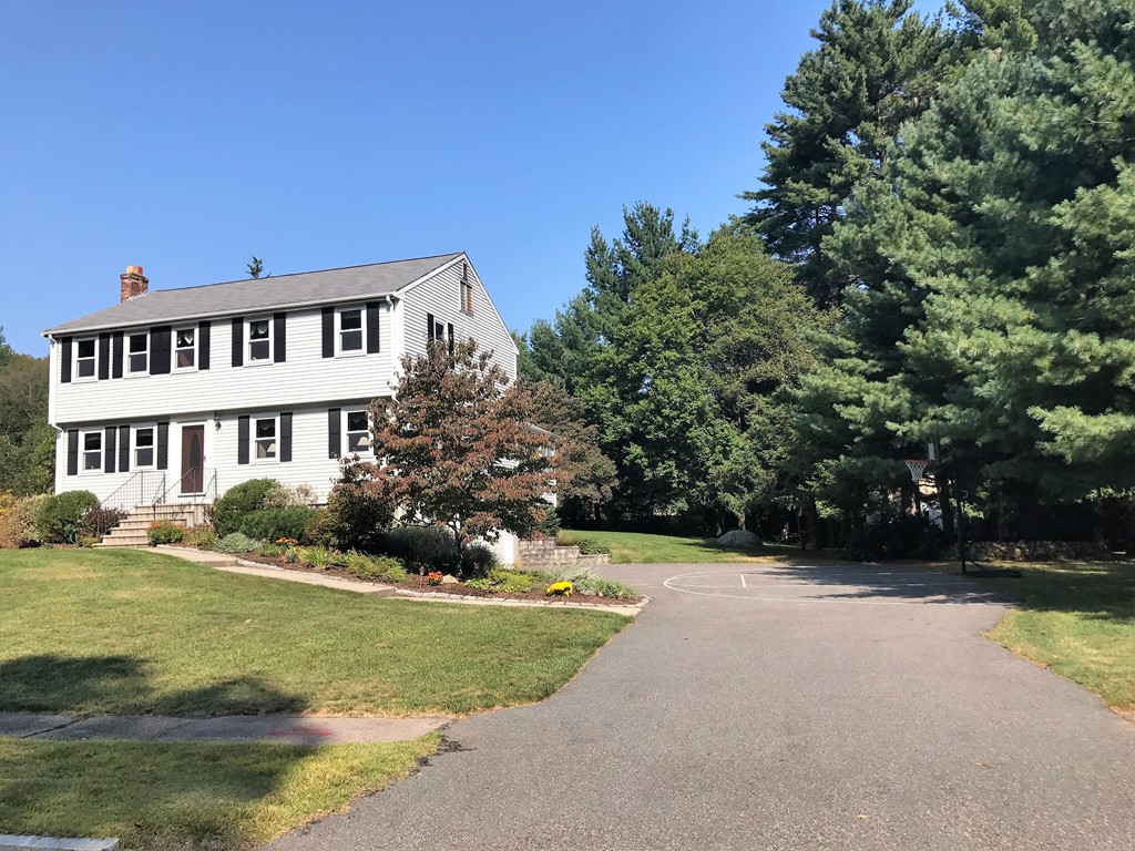 9 Green Valley Road Medway, MA 02053 - Photo 3 of 30 a front view of a house with a garden and yard