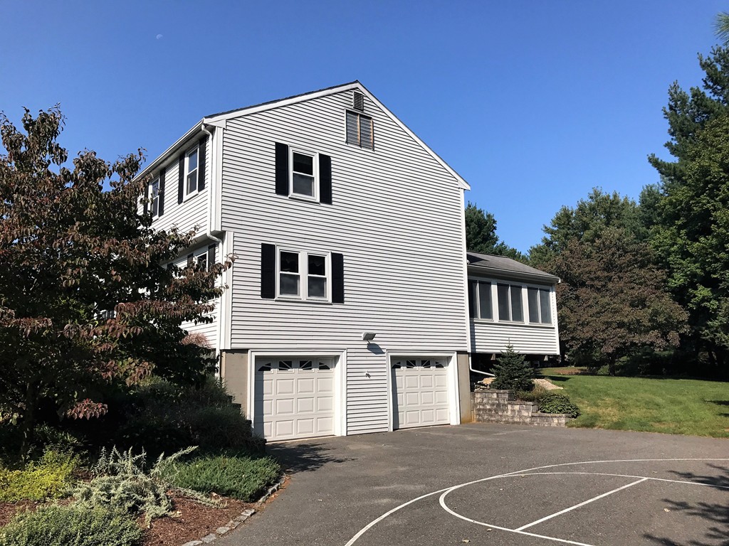 9 Green Valley Road Medway, MA 02053 - Photo 4 of 30 a front view of a house with a garden
