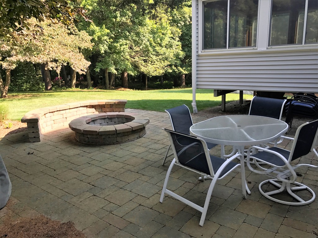 9 Green Valley Road Medway, MA 02053 - Photo 8 of 30 a view of a backyard with table and chairs and potted plants