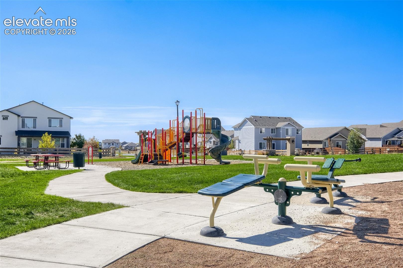 10149 Angeles Road Peyton, CO 80831 - Photo 20 of 24 Community green space featuring a playground and concrete pathways