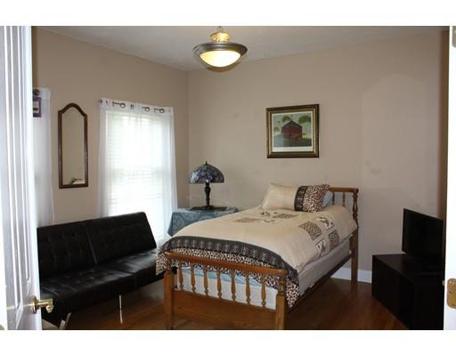 64 Middleboro Road Freetown, MA 02717 - Photo 13 of 30 a bedroom with a bed window and a table