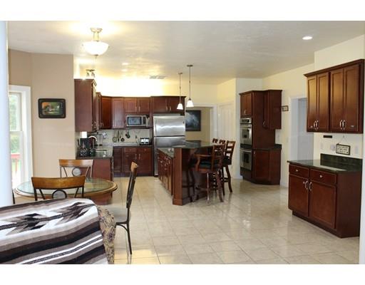 64 Middleboro Road Freetown, MA 02717 - Photo 4 of 30 a living room with stainless steel appliances kitchen island granite countertop furniture and a kitchen view