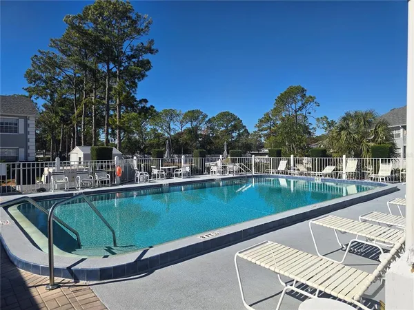 a view of a swimming pool with a patio