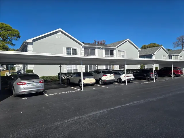 a view of a car park in front of house
