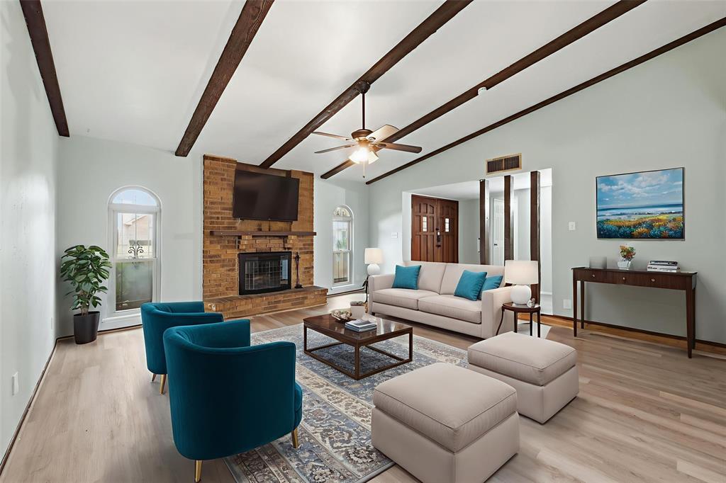 2102 Lewis Trail Grand Prairie, TX 75052 - Photo 2 of 33 a living room with furniture and a fireplace