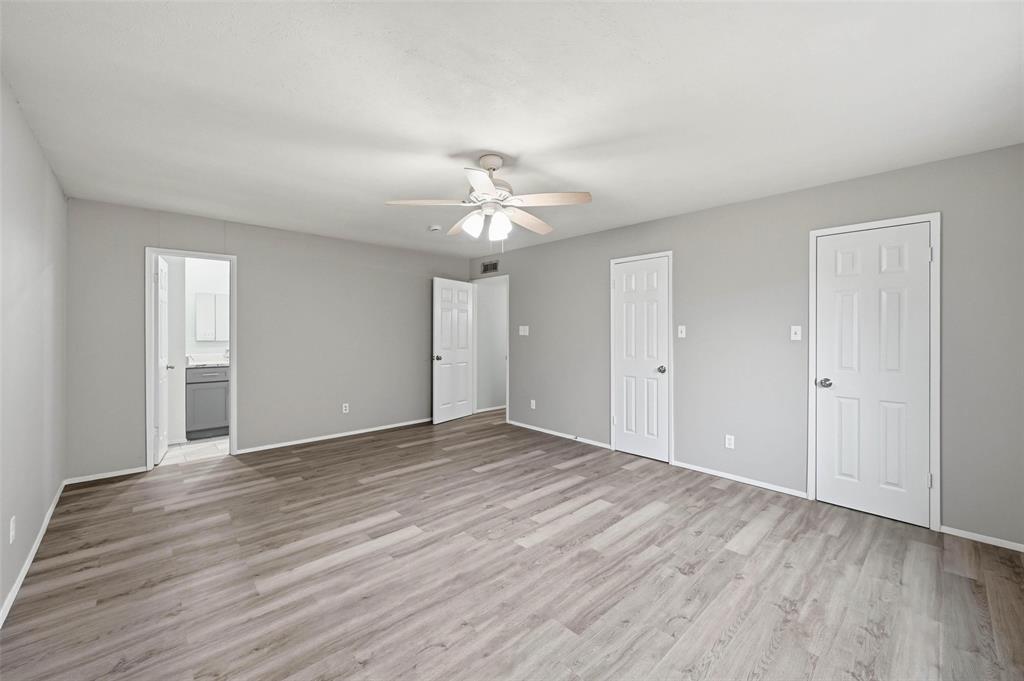 2102 Lewis Trail Grand Prairie, TX 75052 - Photo 23 of 33 a view of an empty room with wooden floor