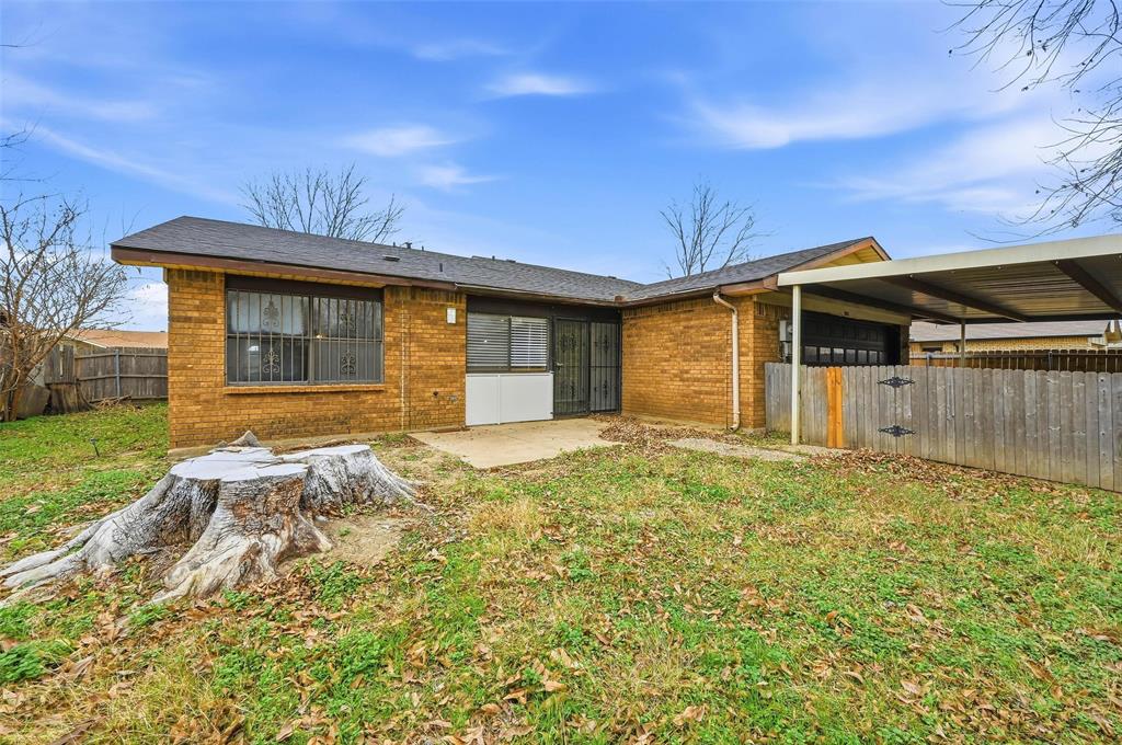 2102 Lewis Trail Grand Prairie, TX 75052 - Photo 27 of 33 a front view of a house with a yard