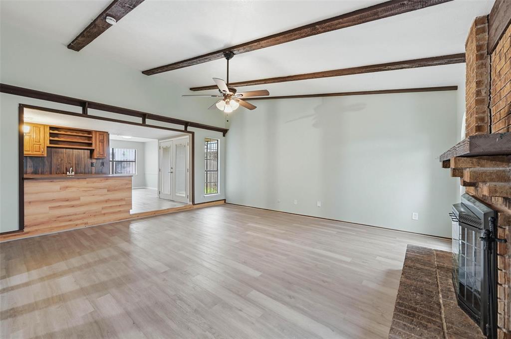 2102 Lewis Trail Grand Prairie, TX 75052 - Photo 3 of 33 a view of a livingroom with wooden floor