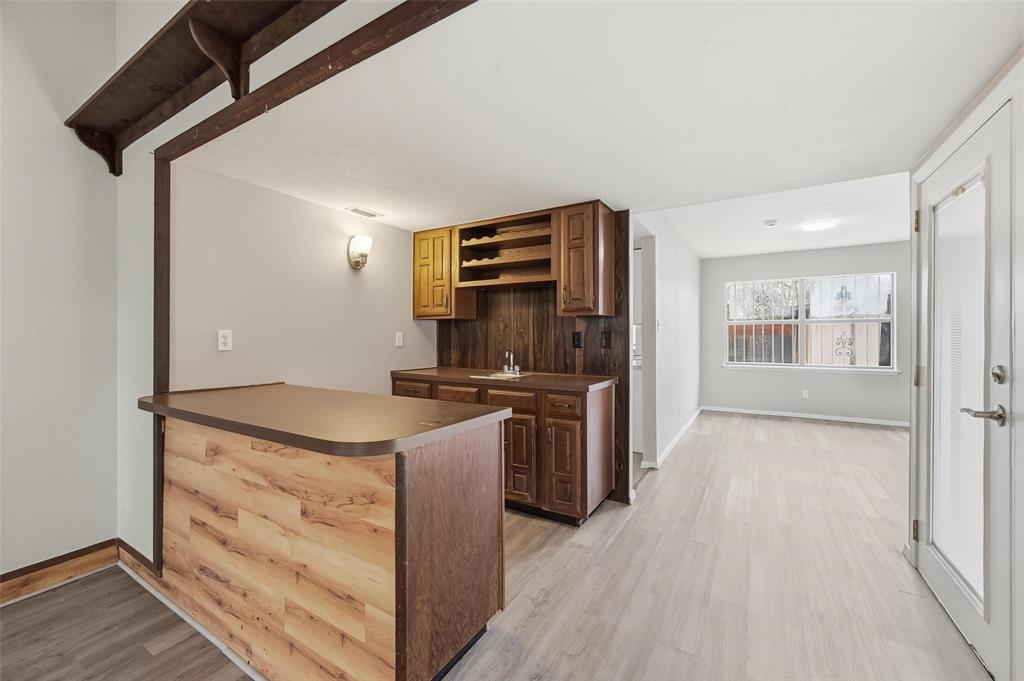 2102 Lewis Trail Grand Prairie, TX 75052 - Photo 5 of 33 a kitchen with granite countertop a stove and a refrigerator