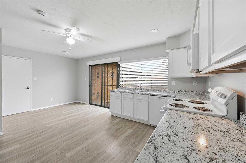 2102 Lewis Trail Grand Prairie, TX 75052 - Photo 9 of 33 a kitchen with a refrigerator a sink and dishwasher