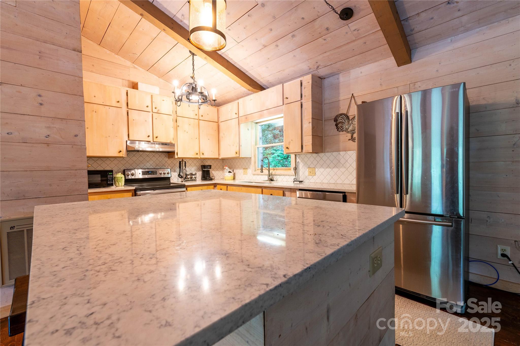 479 Big Ridge Road Burnsville, NC 28714 - Photo 12 of 40 a kitchen with stainless steel appliances granite countertop a sink a stove and a refrigerator