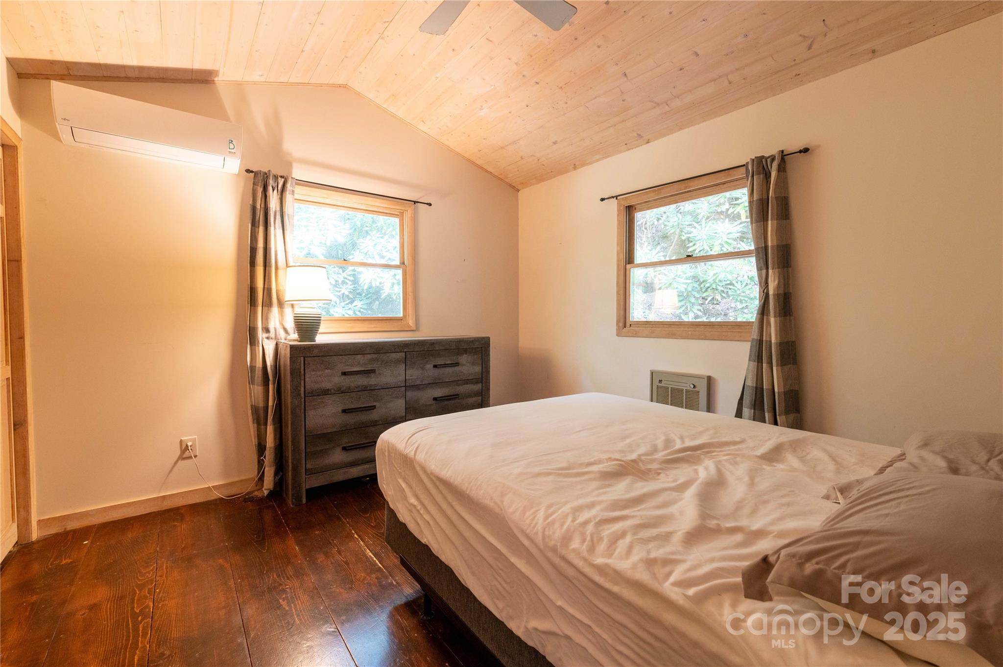 479 Big Ridge Road Burnsville, NC 28714 - Photo 16 of 40 a bedroom with a bed and a window