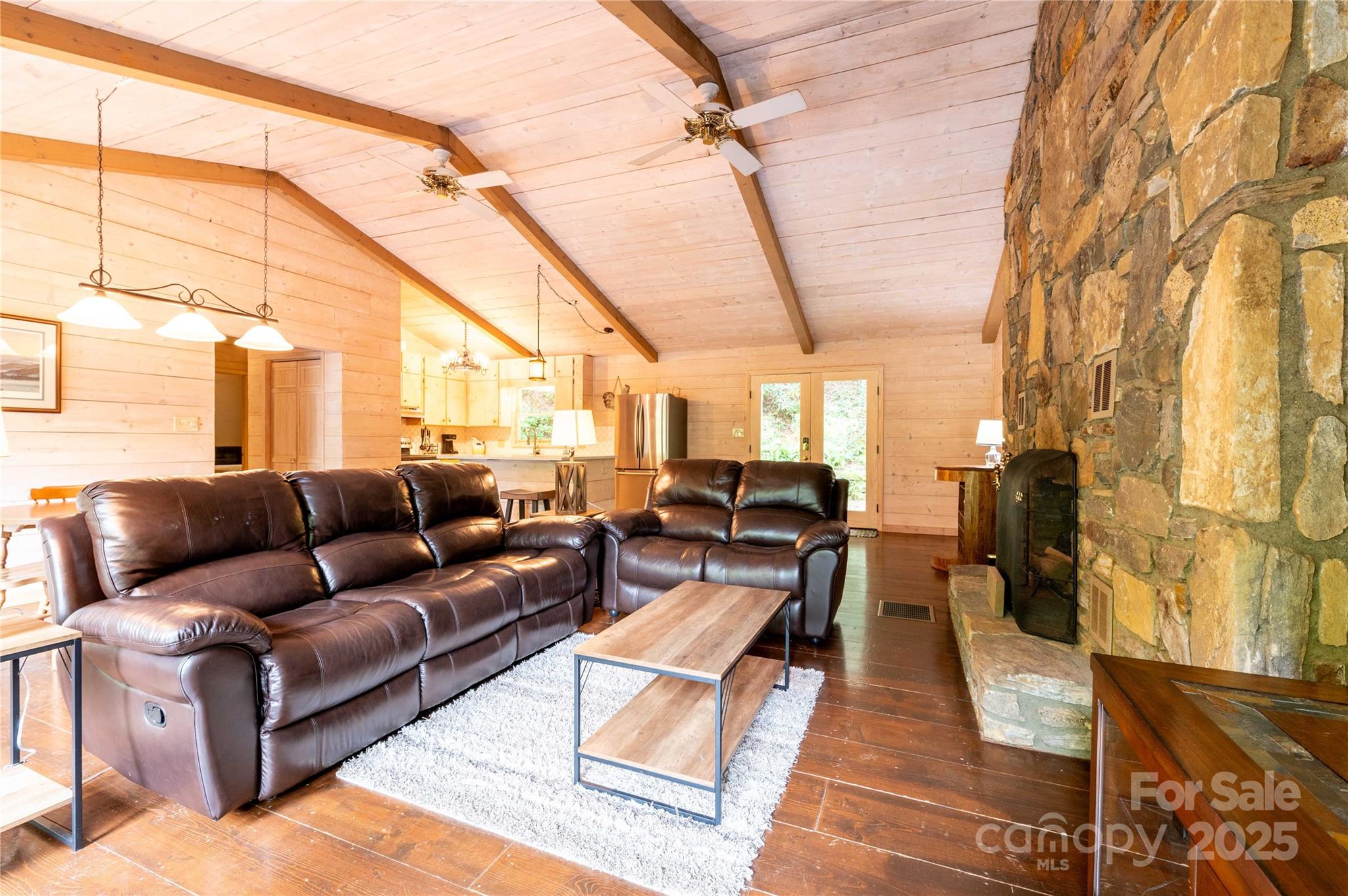 479 Big Ridge Road Burnsville, NC 28714 - Photo 3 of 40 a living room with lots of furniture and a rug