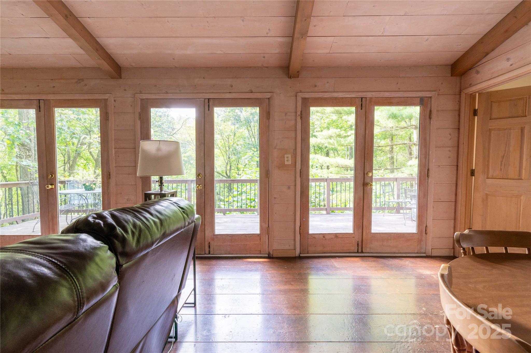 479 Big Ridge Road Burnsville, NC 28714 - Photo 31 of 40 a living room with furniture and a large window