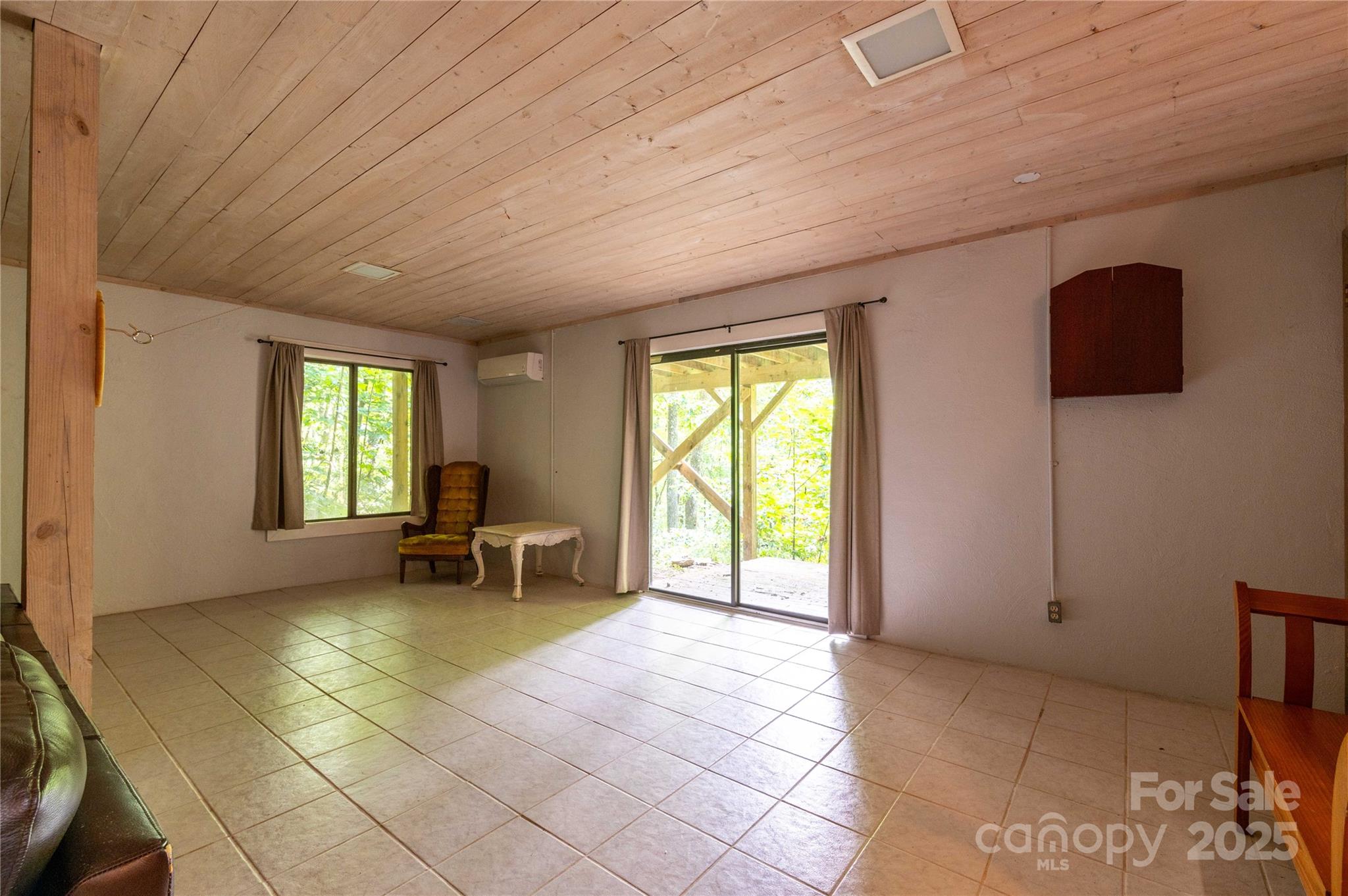 479 Big Ridge Road Burnsville, NC 28714 - Photo 32 of 40 a view of a livingroom with lounge chair and a window