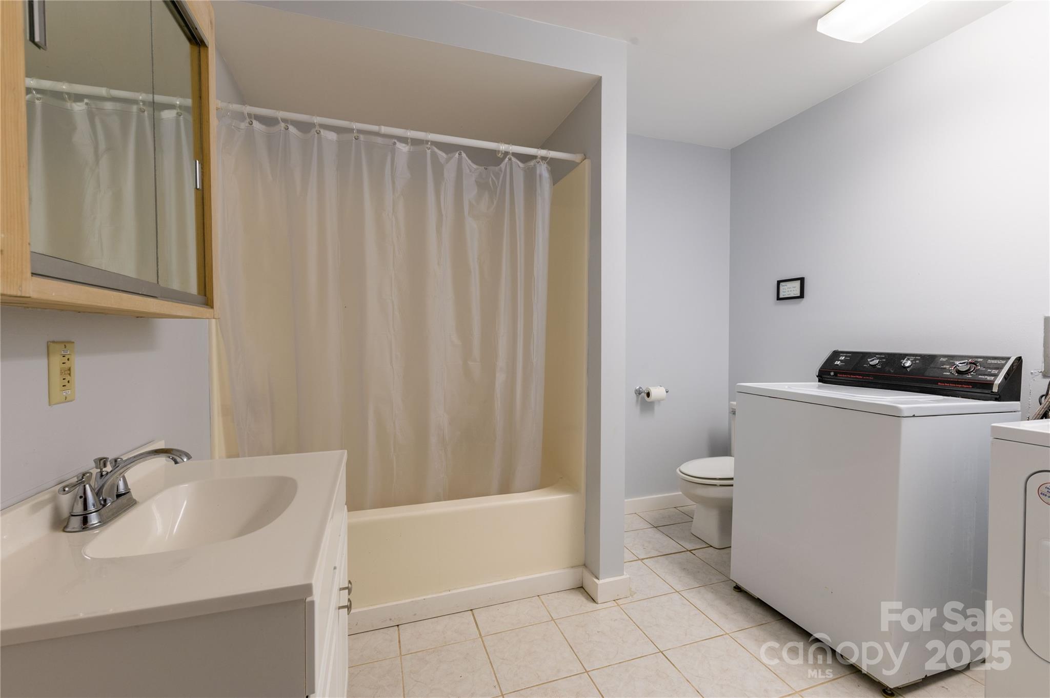 479 Big Ridge Road Burnsville, NC 28714 - Photo 37 of 40 a bathroom with a sink a toilet and shower