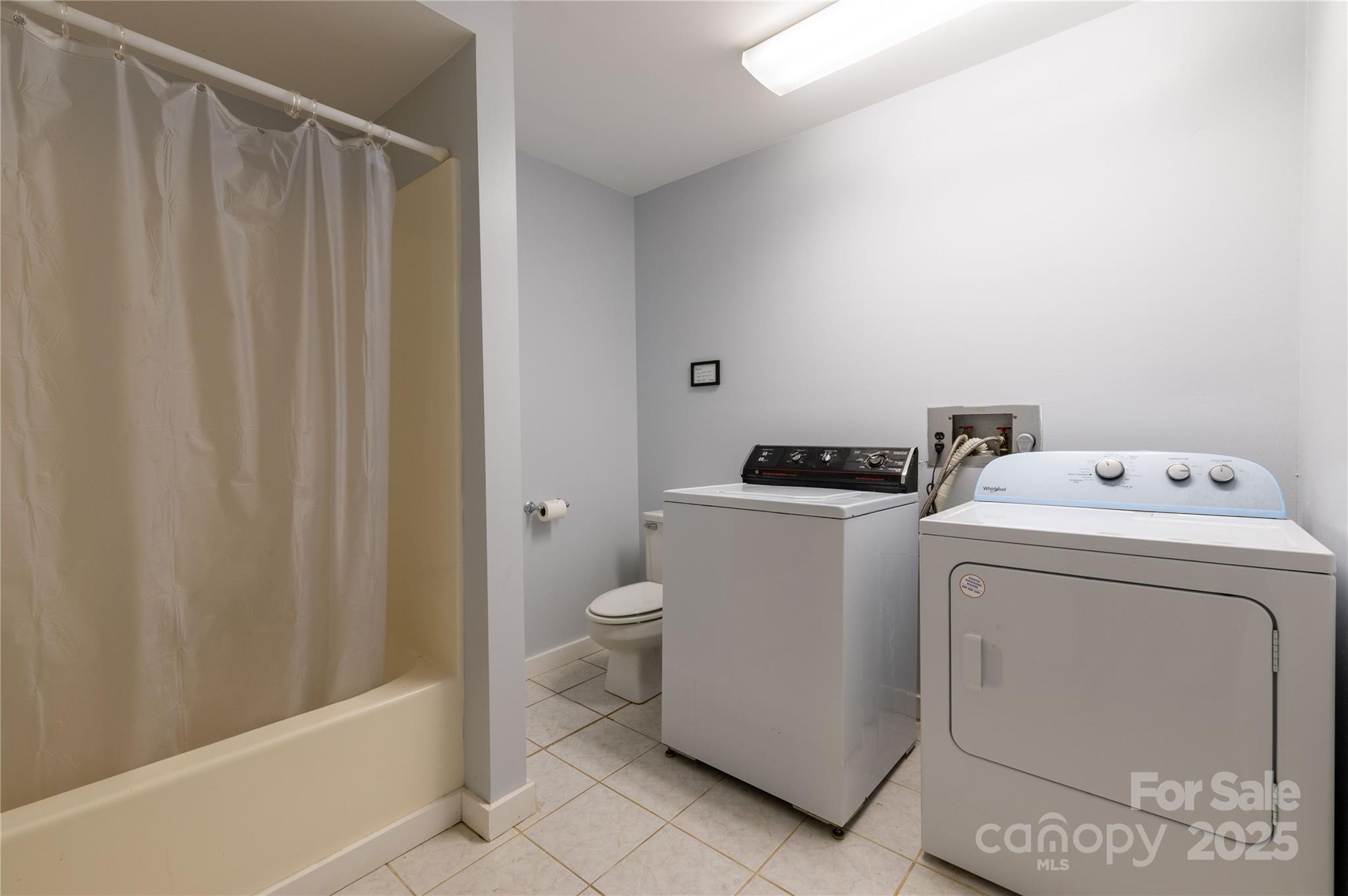 479 Big Ridge Road Burnsville, NC 28714 - Photo 38 of 40 a view of bathroom with a washer and dryer