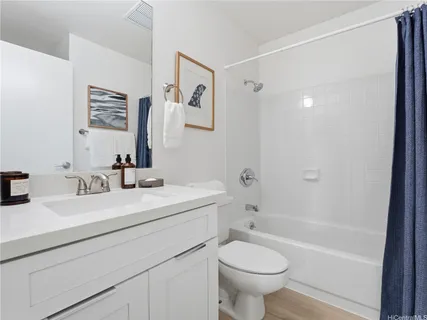 a bathroom with a sink a toilet and a bathtub