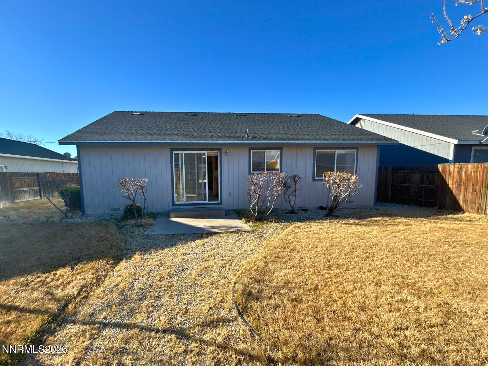 210 Emigrant Way Fernley, NV 89408 - Photo 13 of 14 a front view of a house with garden