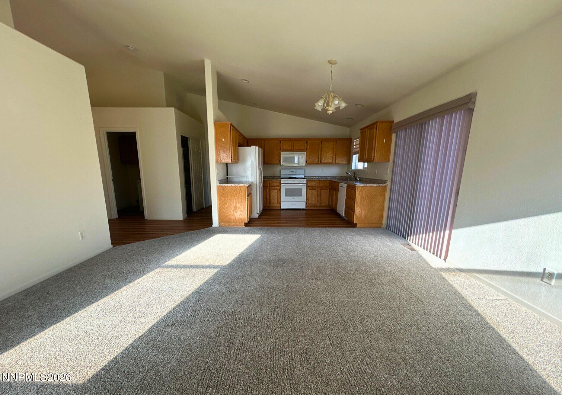 210 Emigrant Way Fernley, NV 89408 - Photo 4 of 14 a view of a livingroom with furniture and a kitchen