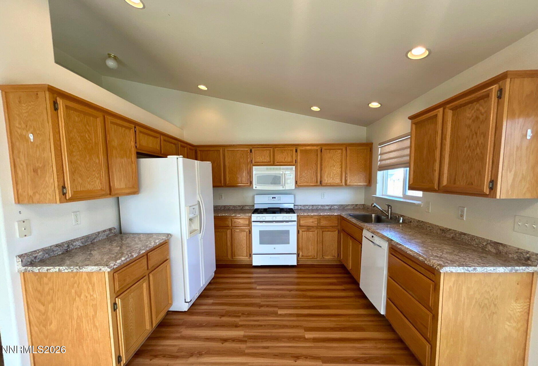 210 Emigrant Way Fernley, NV 89408 - Photo 5 of 14 a kitchen with stainless steel appliances granite countertop a refrigerator a stove and a sink