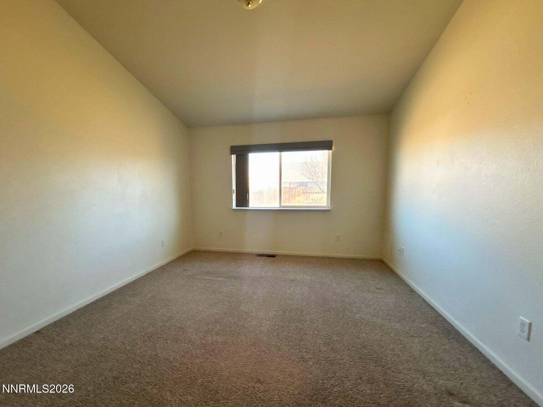 210 Emigrant Way Fernley, NV 89408 - Photo 8 of 14 an empty room with a window