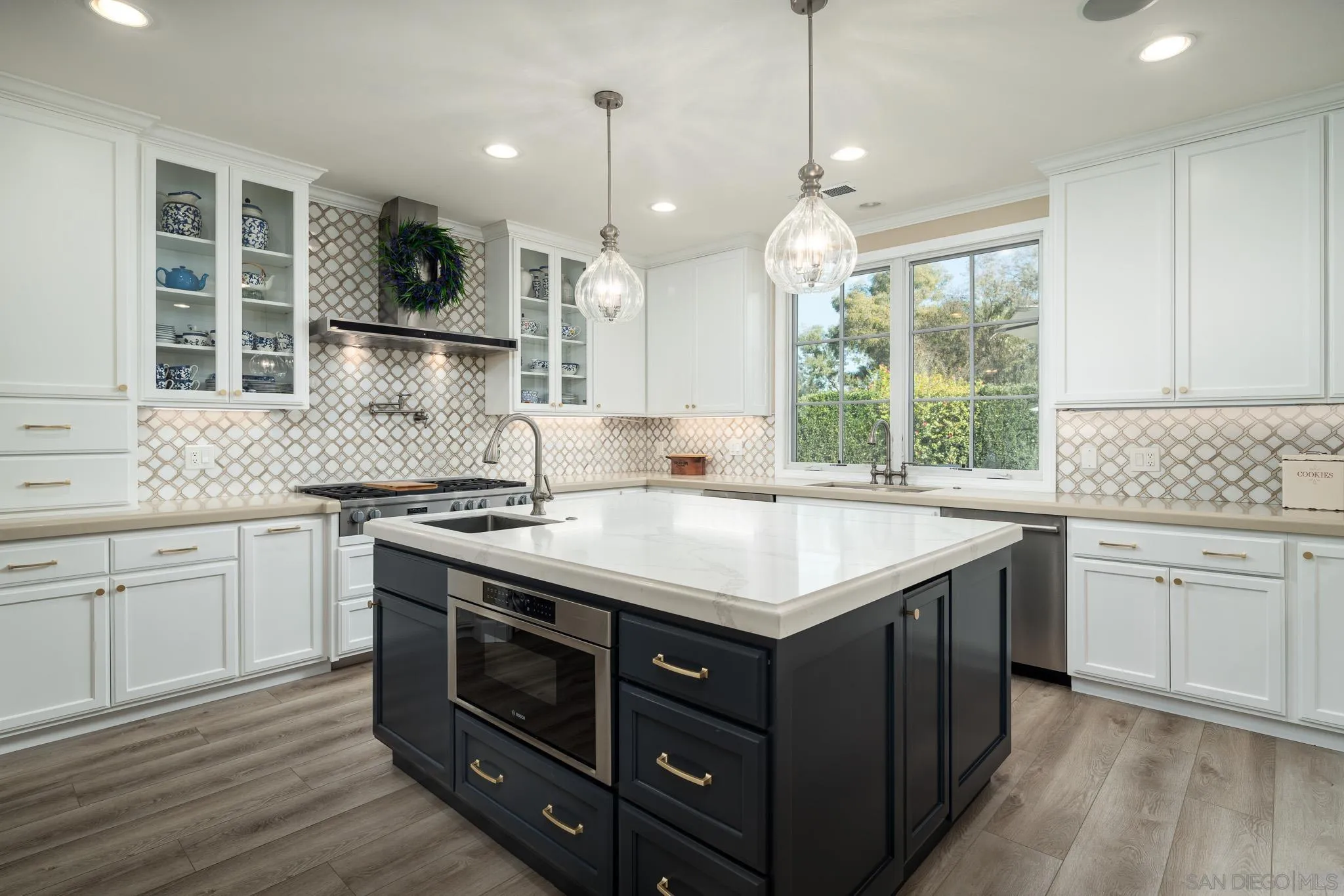 17323 Circa Del Sur Rancho Santa Fe, CA 92067 - Photo 11 of 41 a kitchen with a sink stove and cabinets